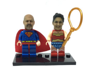 A couple as Superman and Wonderwoman Legos using our Lego compatible heads!